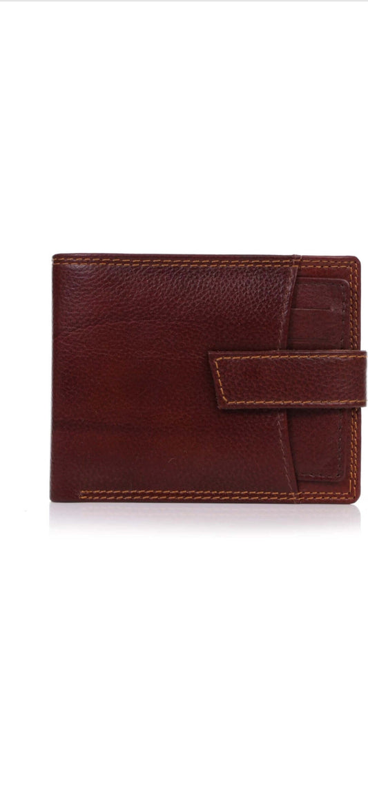 This image is for a listing on my shopify store, unique craftworks. this is a brown genuine leather wallet with multiple pockets, space for cards and strap for closure.