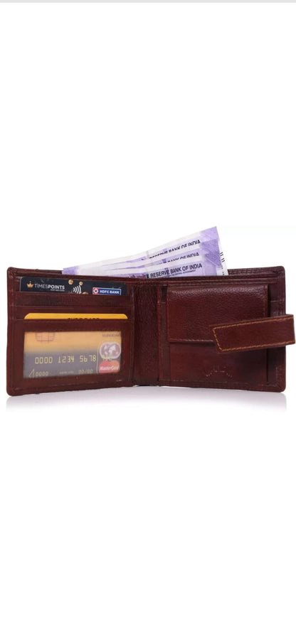 This image is for a listing on my shopify store, unique craftworks. this is a brown genuine leather wallet with multiple pockets, space for cards and strap for closure.